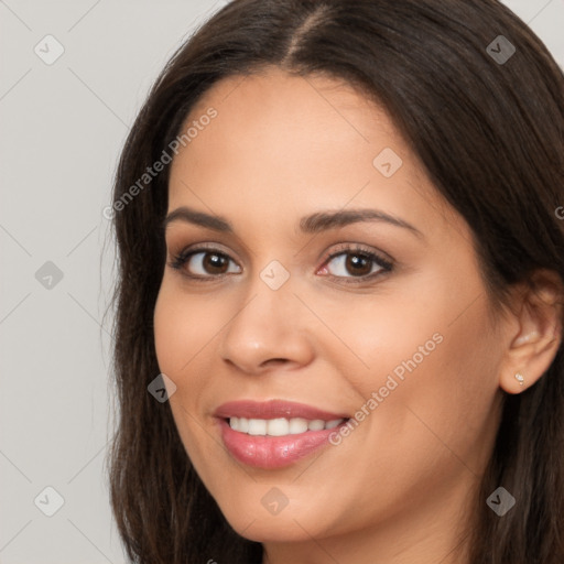 Joyful white young-adult female with long  brown hair and brown eyes