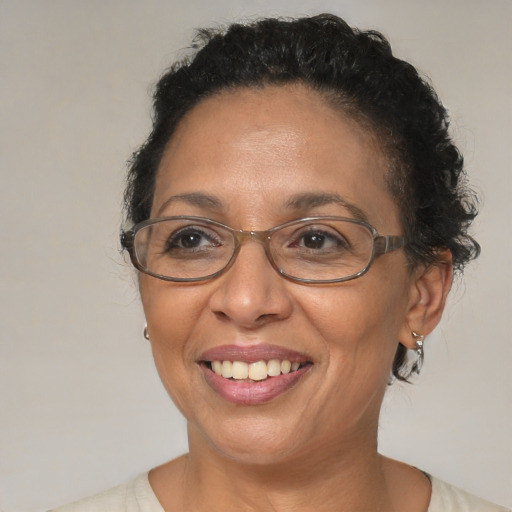 Joyful black adult female with short  brown hair and brown eyes