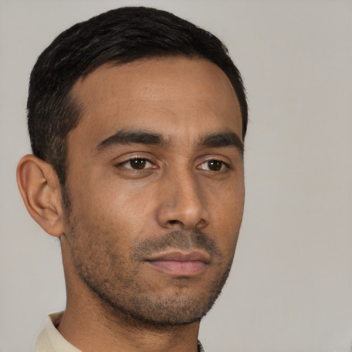 Neutral latino young-adult male with short  black hair and brown eyes