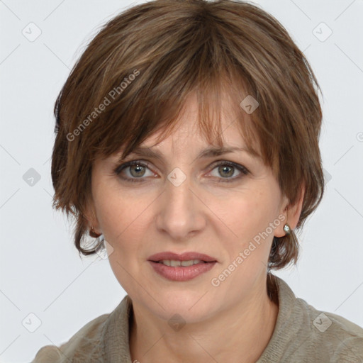 Joyful white adult female with medium  brown hair and grey eyes