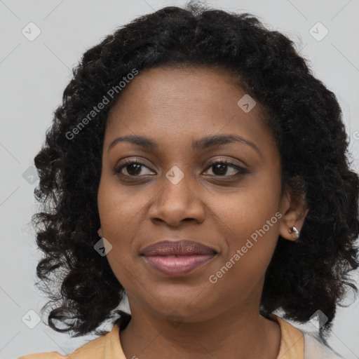 Joyful black young-adult female with long  brown hair and brown eyes