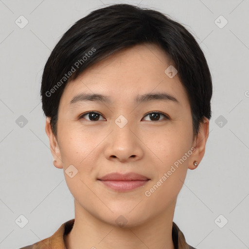 Joyful asian young-adult female with short  black hair and brown eyes