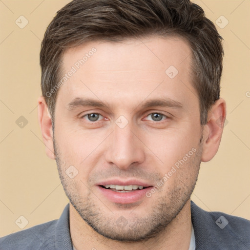 Joyful white young-adult male with short  brown hair and brown eyes