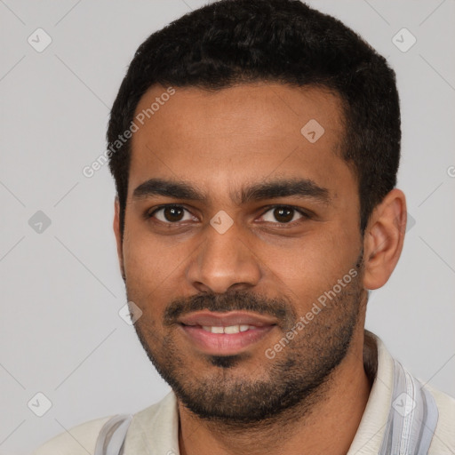 Joyful latino young-adult male with short  black hair and brown eyes