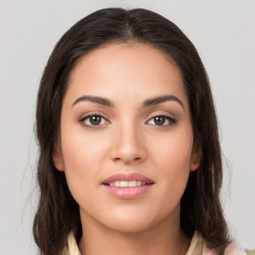 Joyful white young-adult female with medium  brown hair and brown eyes