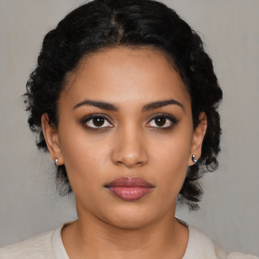 Neutral latino young-adult female with medium  black hair and brown eyes