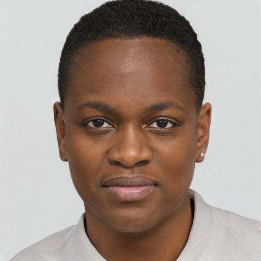 Joyful black young-adult female with short  brown hair and brown eyes