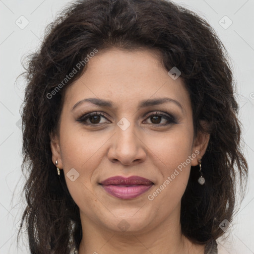 Joyful white adult female with long  brown hair and brown eyes