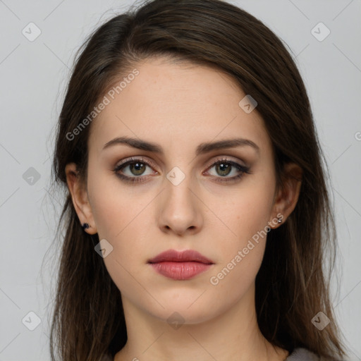 Neutral white young-adult female with long  brown hair and brown eyes