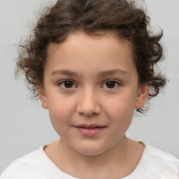 Joyful white child female with short  brown hair and brown eyes