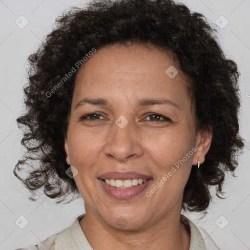 Joyful black adult female with medium  brown hair and brown eyes