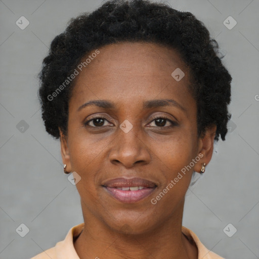 Joyful black adult female with short  brown hair and brown eyes