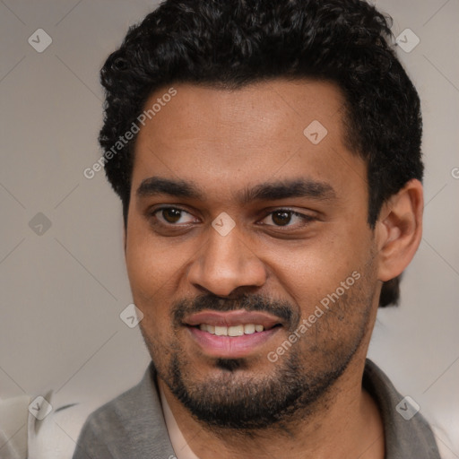 Joyful white young-adult male with short  black hair and brown eyes