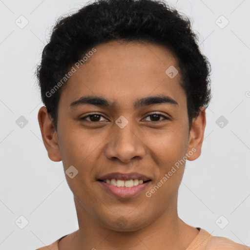 Joyful latino young-adult male with short  brown hair and brown eyes