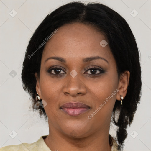 Joyful black adult female with medium  black hair and brown eyes