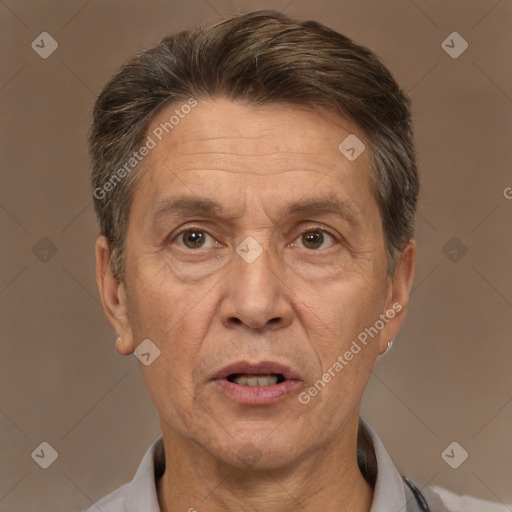 Joyful white middle-aged male with short  brown hair and brown eyes