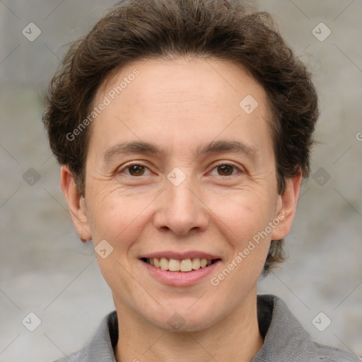 Joyful white adult male with short  brown hair and grey eyes