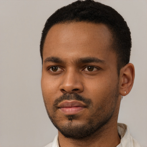 Neutral black young-adult male with short  black hair and brown eyes