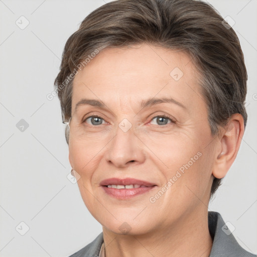 Joyful white adult female with short  brown hair and brown eyes