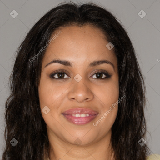 Joyful black young-adult female with long  brown hair and brown eyes