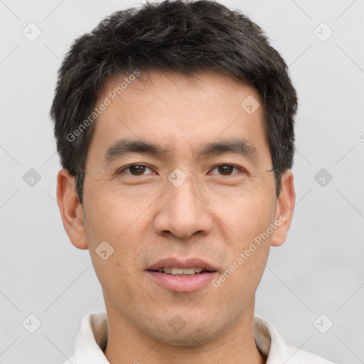 Joyful white adult male with short  brown hair and brown eyes