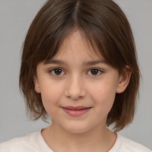 Joyful white child female with medium  brown hair and brown eyes