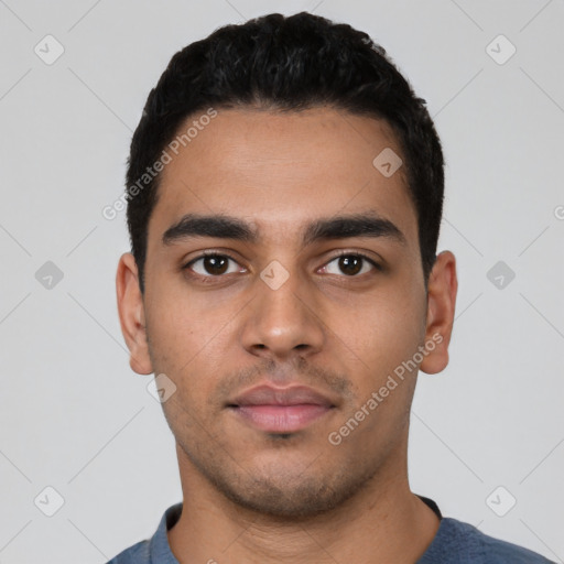 Neutral latino young-adult male with short  black hair and brown eyes