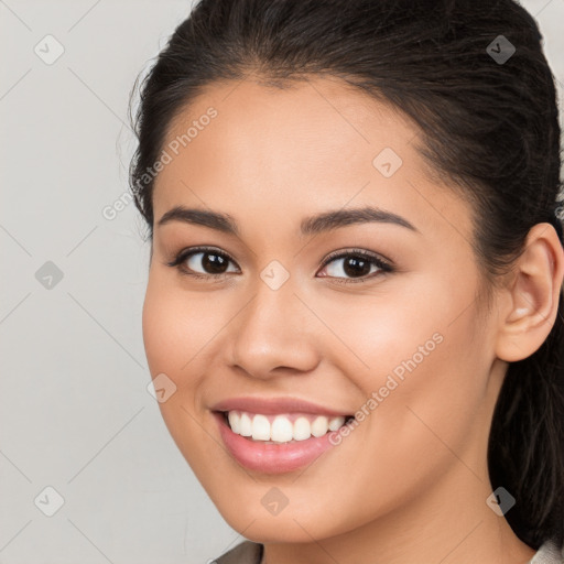 Joyful white young-adult female with long  brown hair and brown eyes