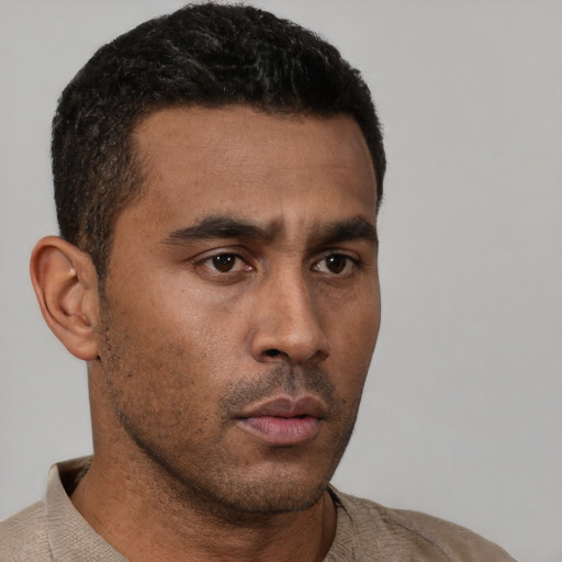 Neutral latino young-adult male with short  brown hair and brown eyes