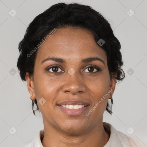 Joyful black adult female with short  black hair and brown eyes