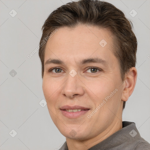 Joyful white adult male with short  brown hair and brown eyes