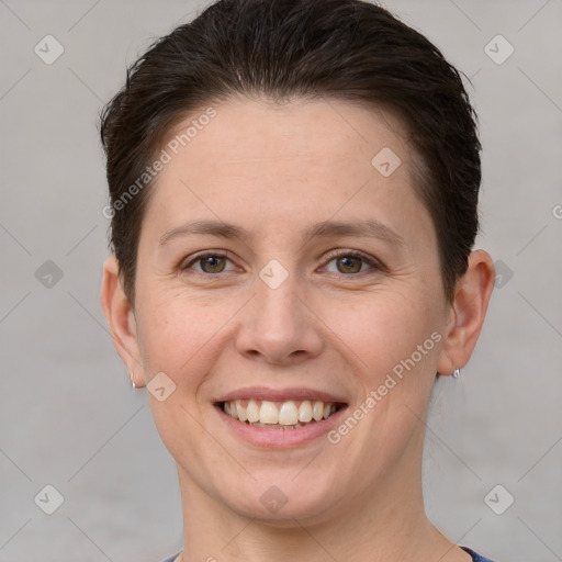 Joyful white young-adult female with short  brown hair and grey eyes