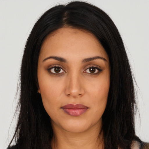 Neutral latino young-adult female with long  black hair and brown eyes