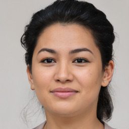 Joyful asian young-adult female with medium  brown hair and brown eyes