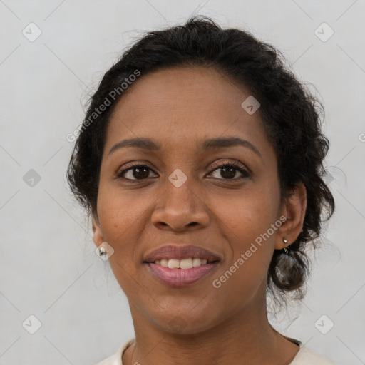 Joyful latino adult female with medium  brown hair and brown eyes