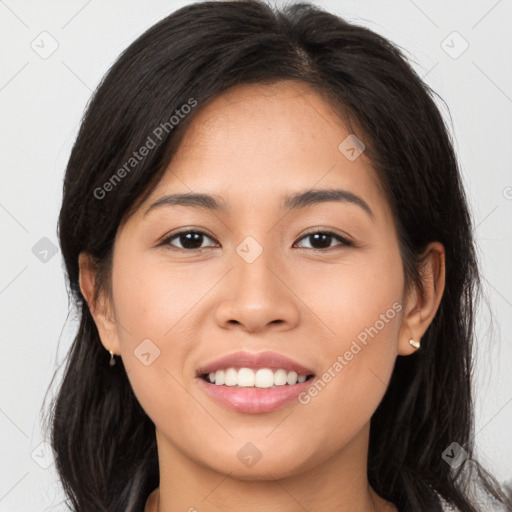 Joyful white young-adult female with long  brown hair and brown eyes