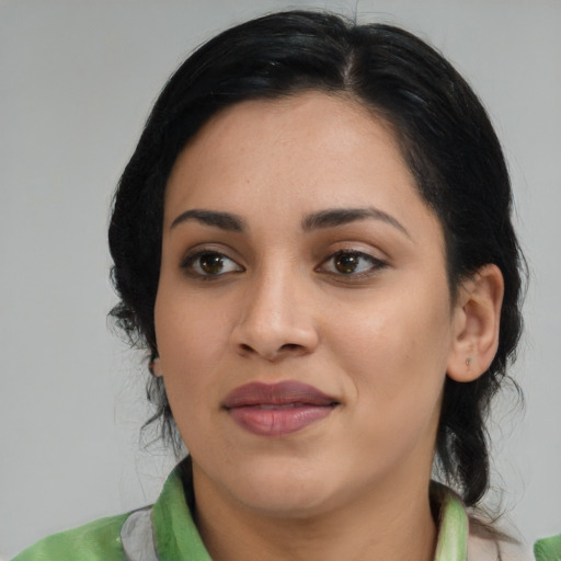 Joyful asian young-adult female with medium  black hair and brown eyes