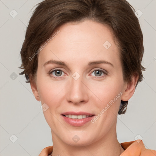 Joyful white young-adult female with short  brown hair and grey eyes