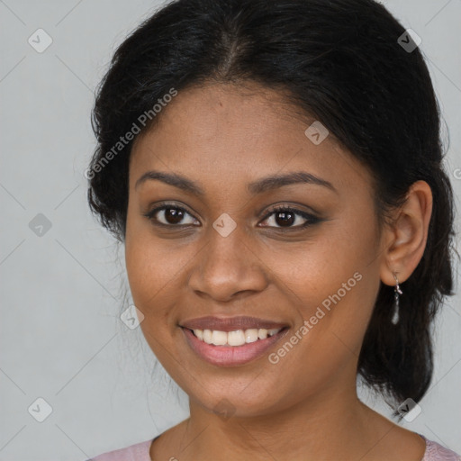 Joyful black young-adult female with long  brown hair and brown eyes