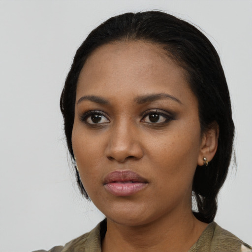 Neutral black young-adult female with medium  black hair and brown eyes