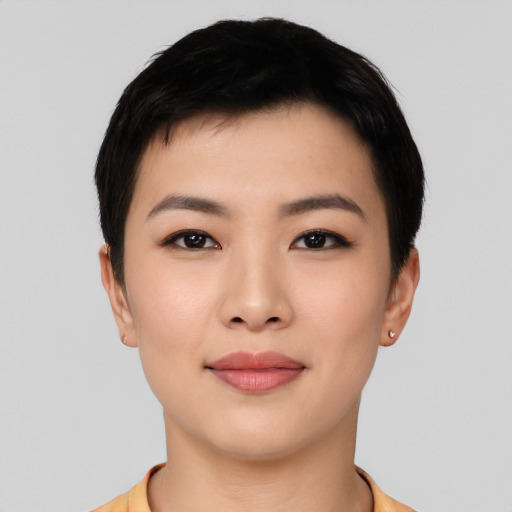 Joyful asian young-adult female with short  black hair and brown eyes