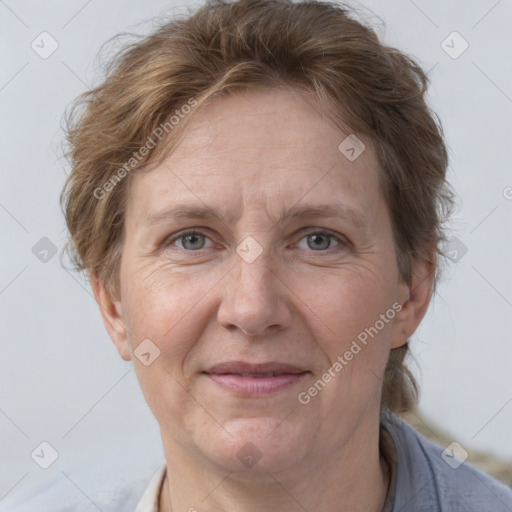 Joyful white adult female with short  brown hair and grey eyes