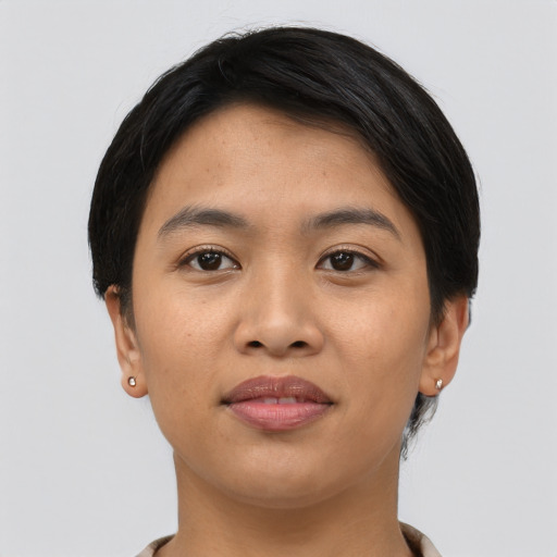Joyful asian young-adult female with short  black hair and brown eyes