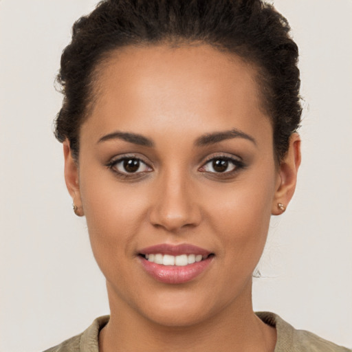 Joyful white young-adult female with short  brown hair and brown eyes