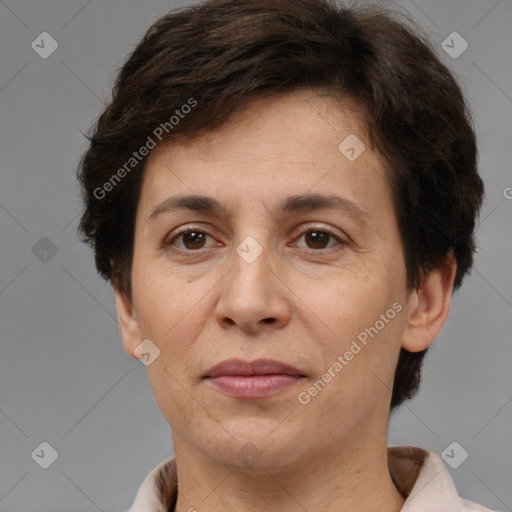 Joyful white adult female with short  brown hair and brown eyes