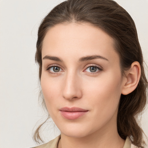 Neutral white young-adult female with medium  brown hair and grey eyes