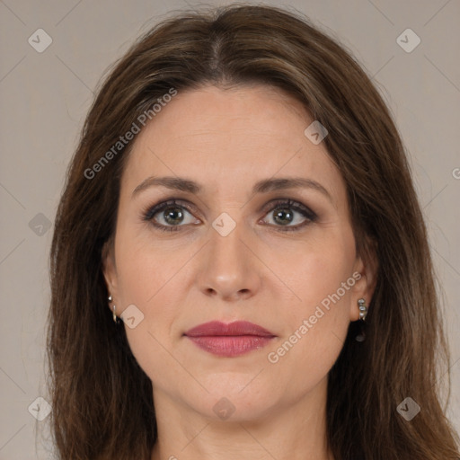 Joyful white adult female with long  brown hair and brown eyes