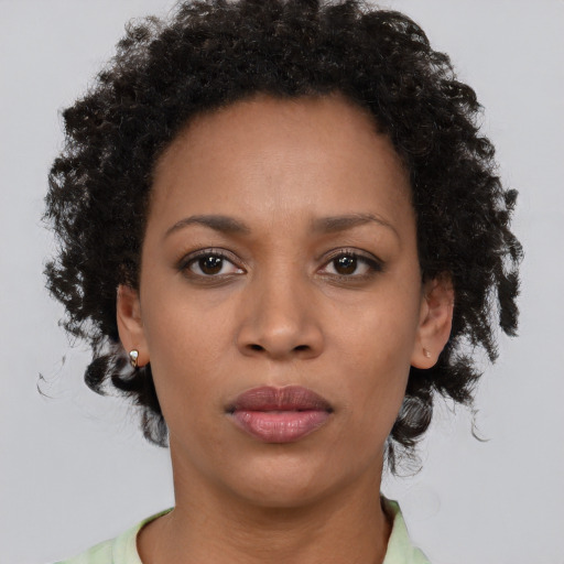 Neutral black young-adult female with short  brown hair and brown eyes