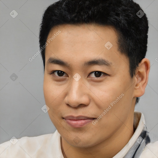 Joyful latino young-adult male with short  black hair and brown eyes