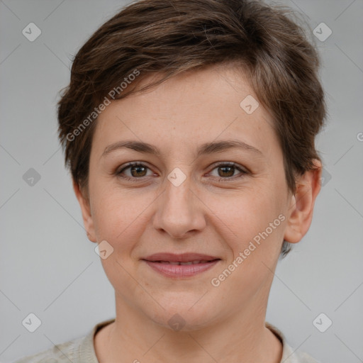 Joyful white young-adult female with short  brown hair and grey eyes